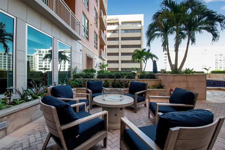 Fire pit near spa, grill and lap pool
