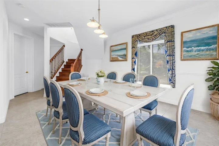 Formal dining area and stairs to main bedroom