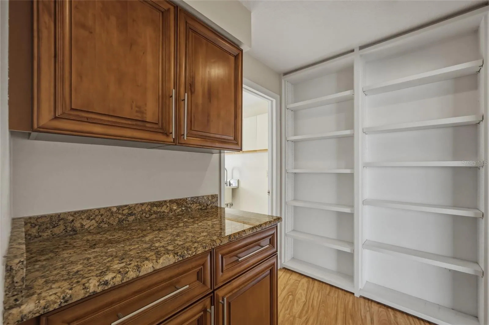 HALL AREA TO THE 2 BEDROOMS AND FULL BATH