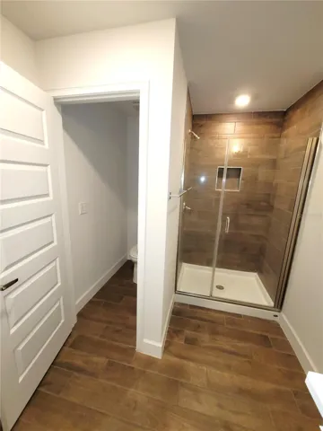 Water closet and glass enclosed shower