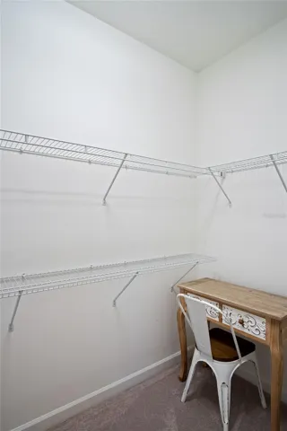 1 of 2 walk in closet in Primary bedroom