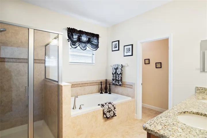 Primary Bathroom, soaking tub, walk in shower and dual sinks.