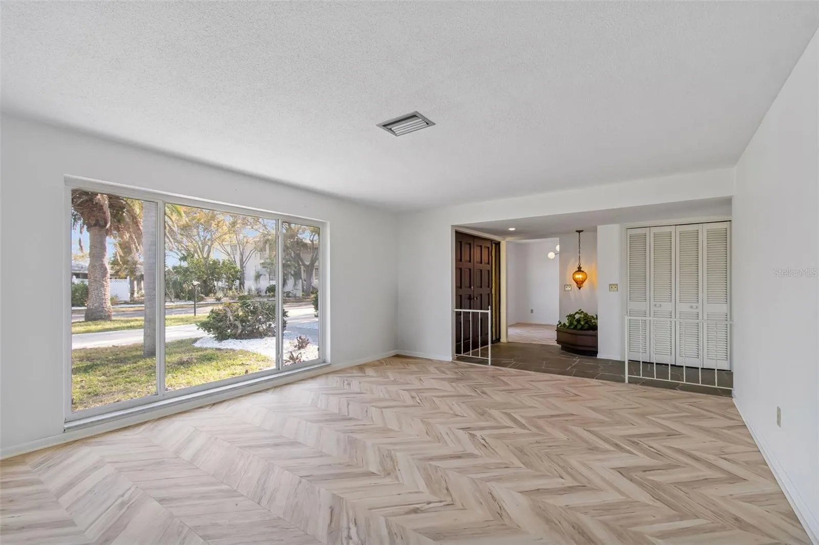 Another view of Living Room..check those new floors and fresh white paint throughout