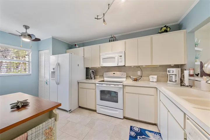 Full size washer and dryer in kitchen