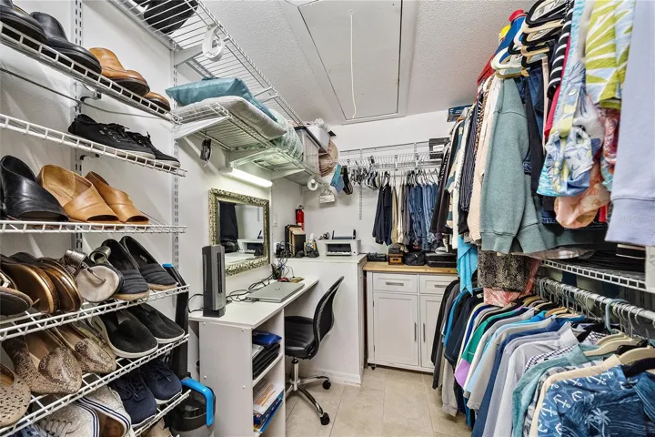 attic storage plus desk in the walk-in closet