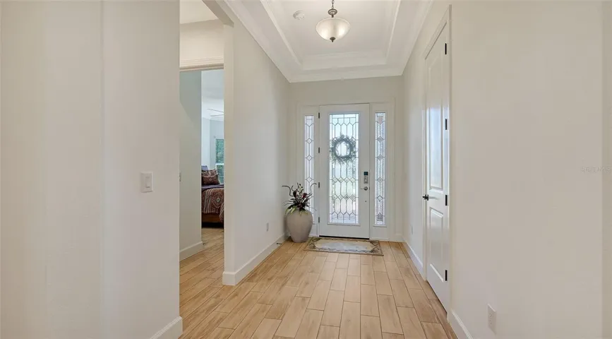 Front hall with entry to bedroom and bathroom 3 on left side