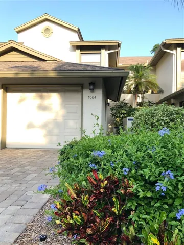 Front elevation. Garage & hallway to main entrance.
