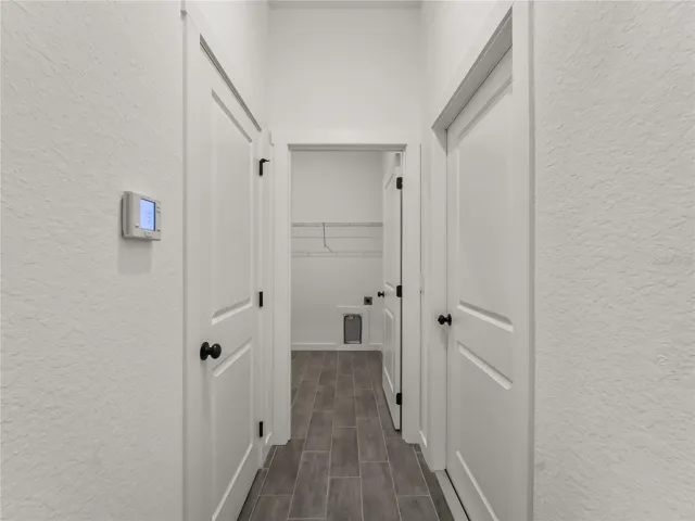Hallway to Interior Laundry and garage