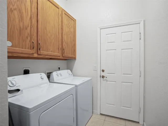 Inside Laundry rm w/extra cabinet space!