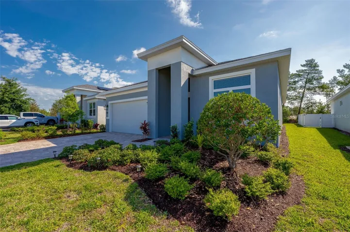 Entrance of home with gorgeous curb appeal, second house to the end.