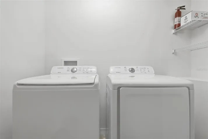 washer and dryer in closet in kitchen