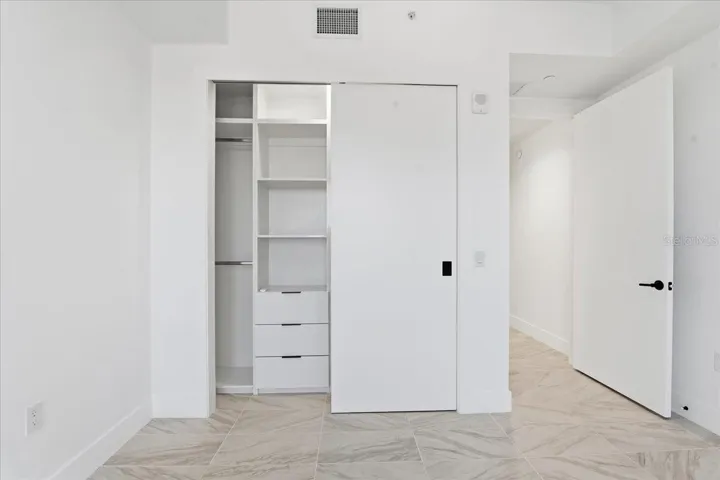 CUSTOM BUILT CLOSET IN THE GUEST BEDROOM