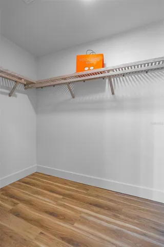 Spacious primary walk-in closet for convenience and luxury