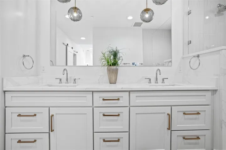 Primary Bath with double sinks and large, walk-in shower