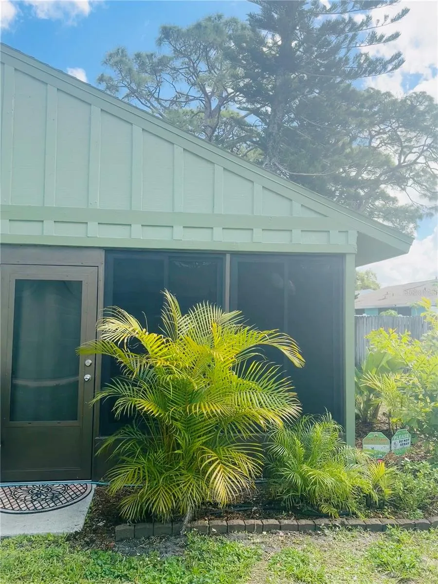 west-facing side of house with back door off the lanai