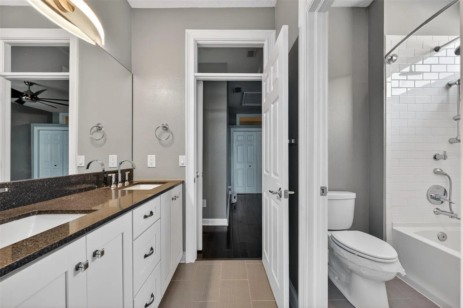 Bathroom 2 has double vainity with plenty of storage and tub shower combination