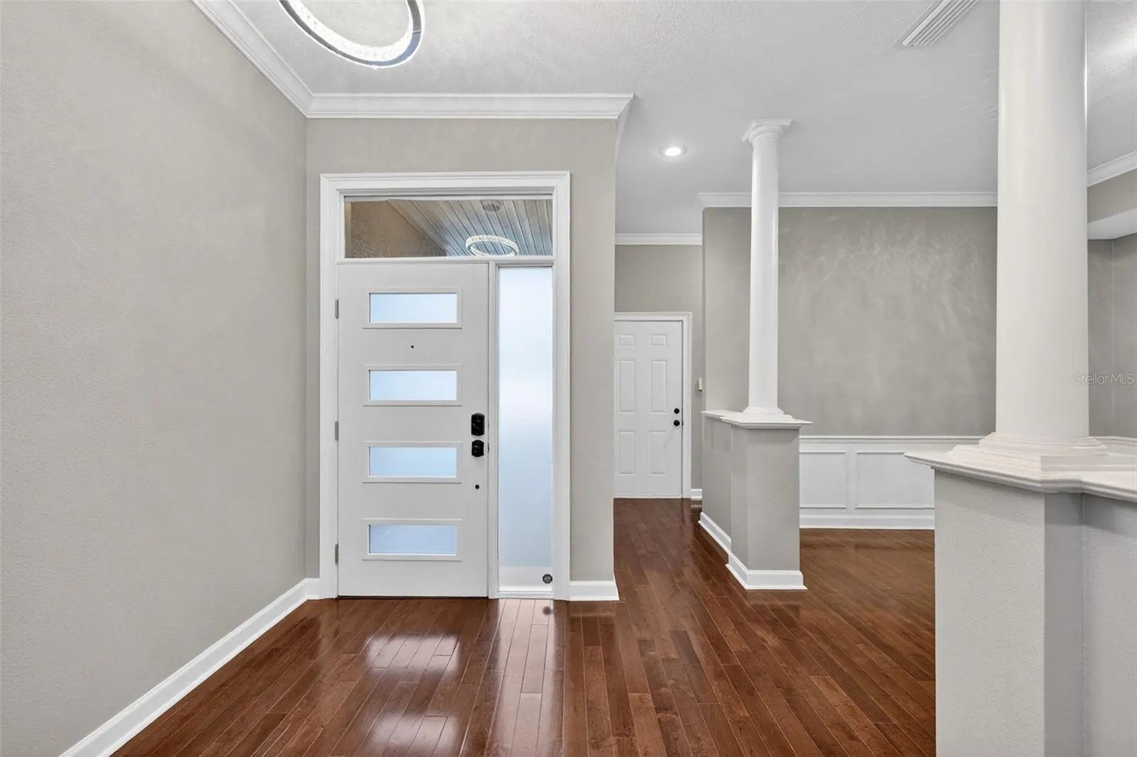 Beautiful entry door and to the right is the door leading into your garage and hallway to half bath