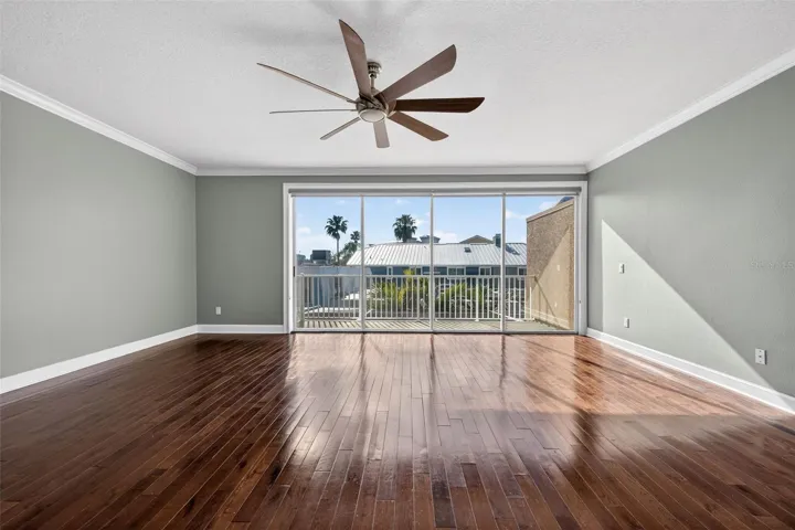 Primary Bedroom is large and spacious and has sliding doors with a private balcony