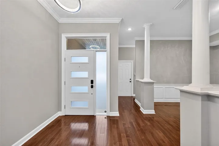 Beautiful entry door and to the right is the door leading into your garage and hallway to half bath