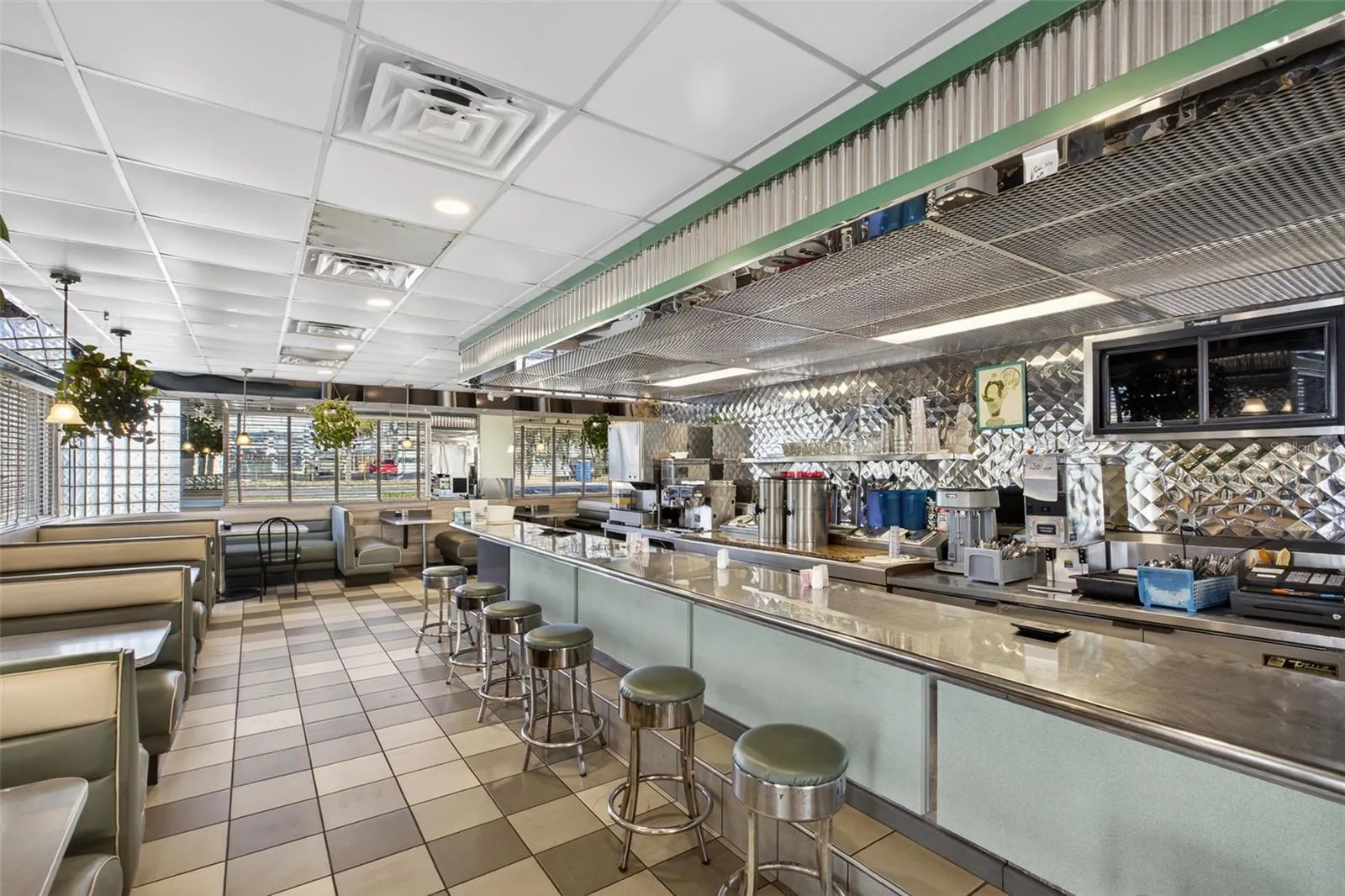 Turnkey diner interior with established dining layout included in restaurant and real estate sale.