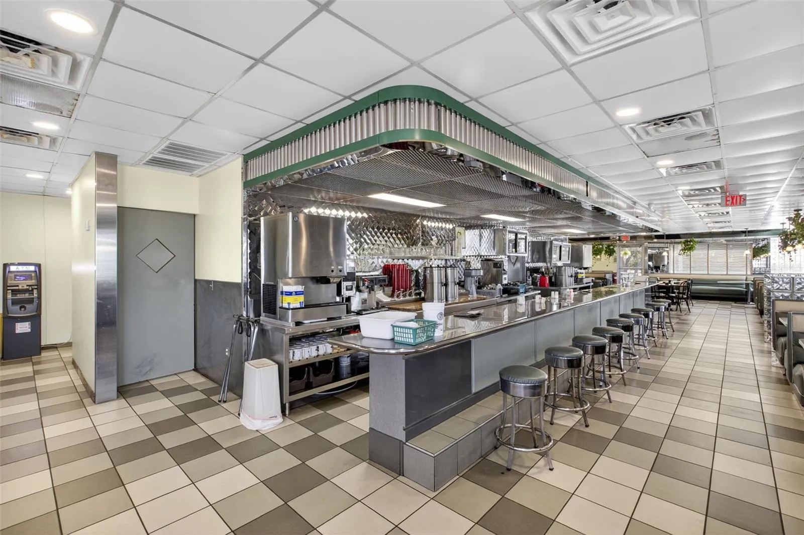 Turnkey diner interior with established dining layout included in restaurant and real estate sale.