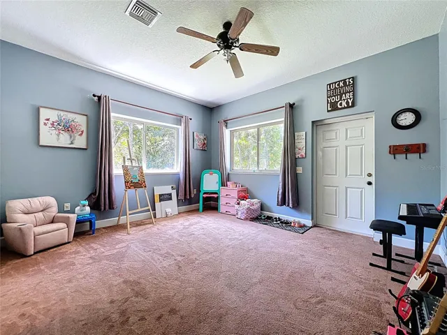 GUEST SUITE WITH PRIVATE EXTERIOR ENTRANCE IS CURRENTLY USED AS A PLAYROOM