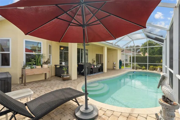 Covered lanai and screen enclosure with pavers