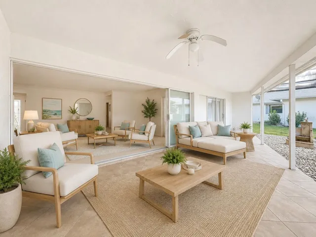 Stunning Indoor-Outdoor Retreat living space with full sliding glass patio doors perfect for entertaining.