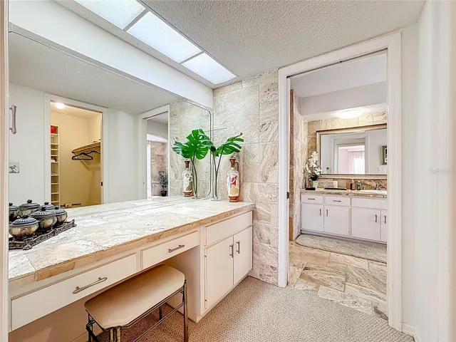 Separate vanity room located in the primary bedroom.A beautifully appointed vanity that elevates every routine makes it easy for everyday comfort in this get-ready space.( Can be converted back to having a sink plumbling is already in place )