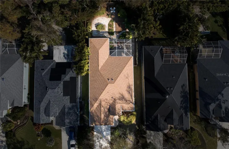 Aerial view of home showing deep lot and screened patio on the back of the home