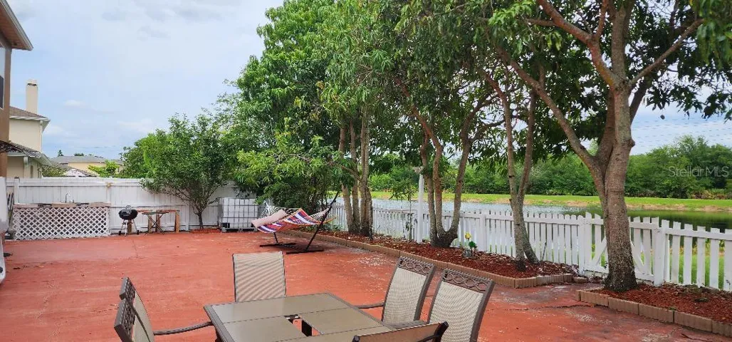 Beautiful Fenced Backyard with Pond Views and Fruit Trees