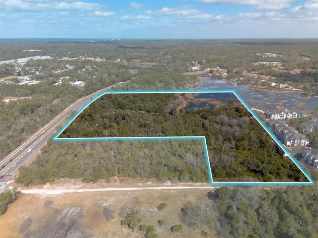 Unpaved Rhode Island Rd planned to connect east to Normandy, across I-4.