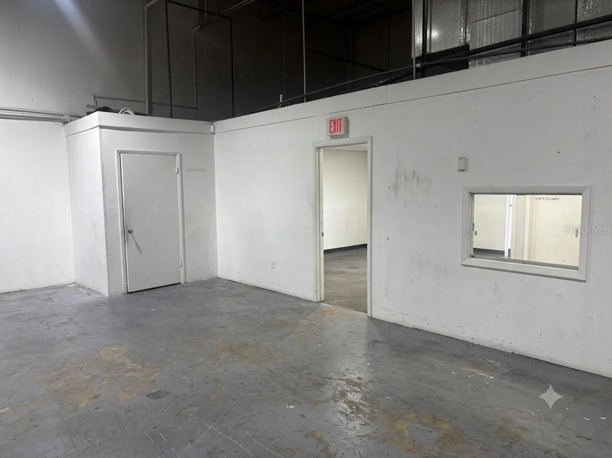 View of private bathroom entrance and office entrance.