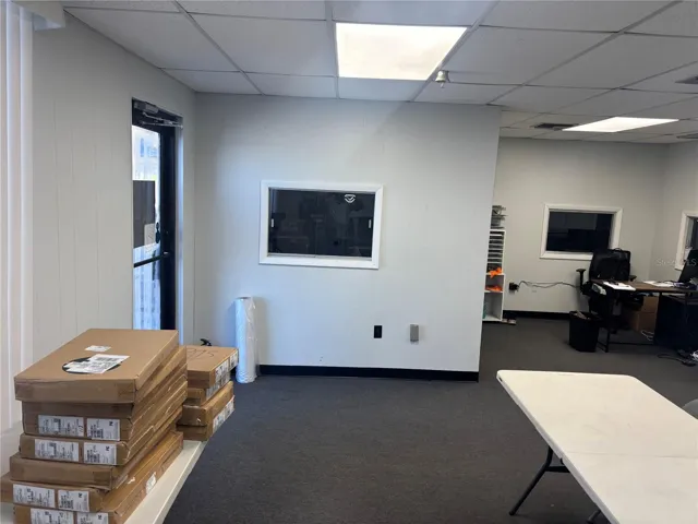 View of entrance toward office space with an extra bonus room.