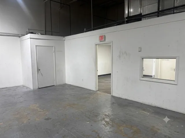 View of private bathroom entrance and office entrance.