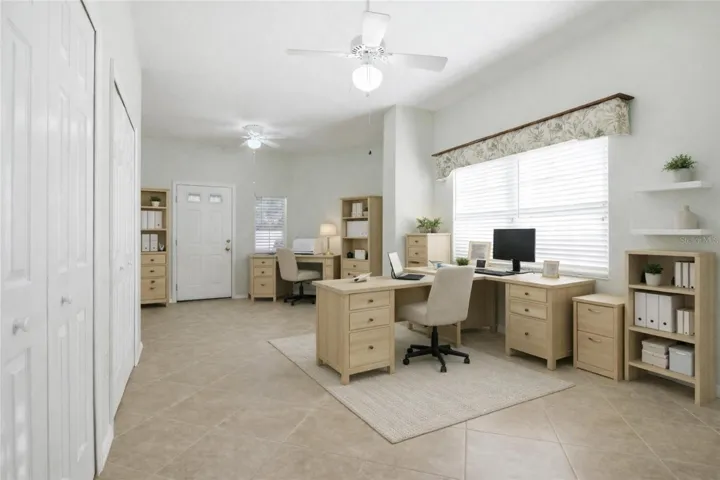 Virtual staged Office in the flex/craft room.