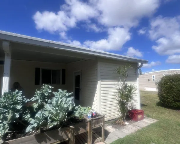 side of carport with shed