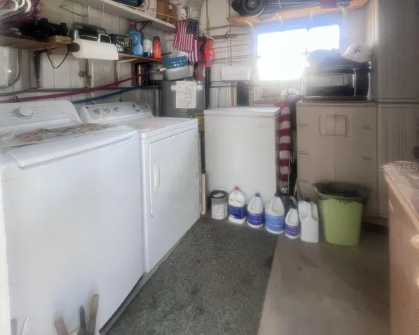Laundry inside shed under carport