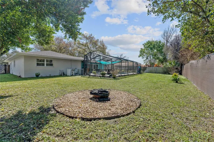 Big, fenced yard with relaxing firepit
