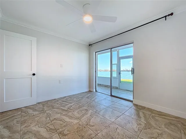 The guest bedroom is a great flex space in this condo.