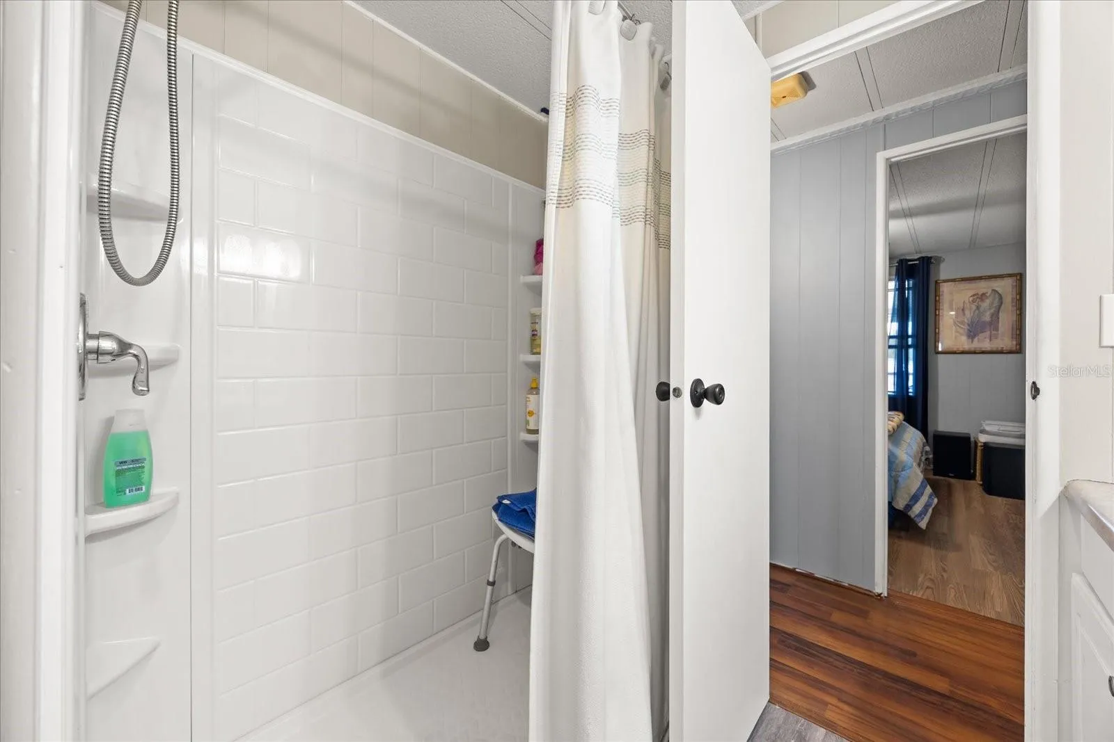 Guest Bathroom with Walk In Shower directly across from Guest Bedroom