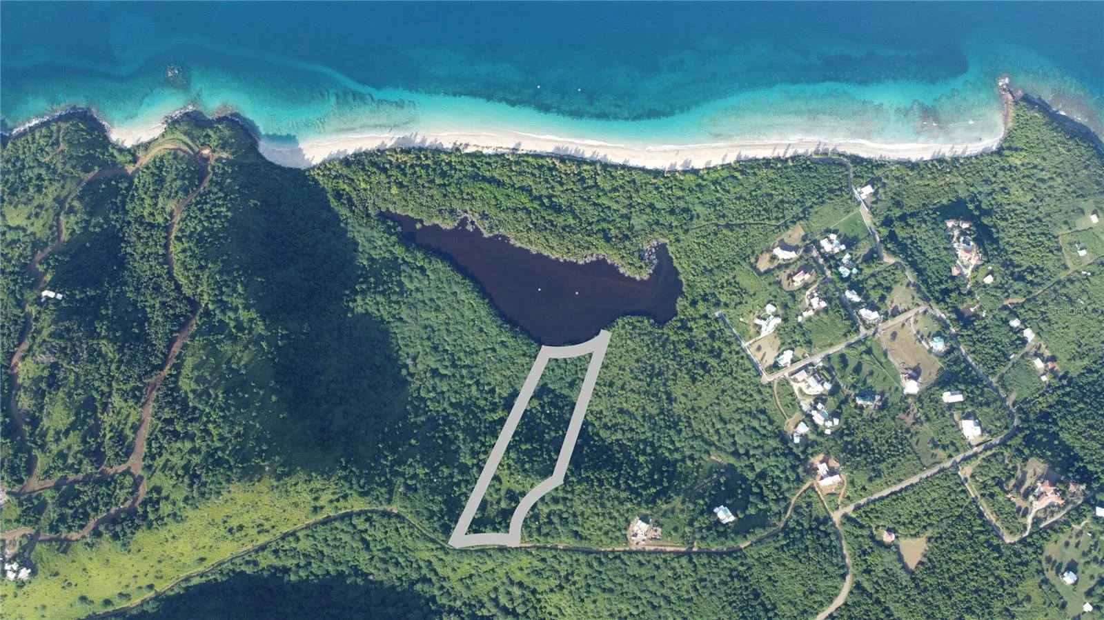 Aerial showing just yards to Zoni Beach.