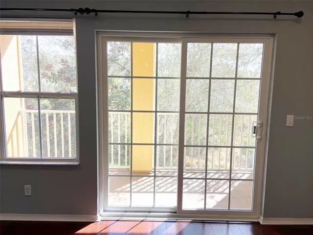Doors leading out to balcony from living area