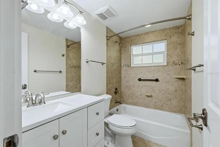 Guest bath with tub & tile surround!