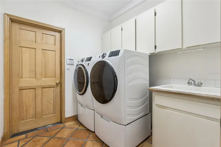 Washer/dryer are included and a sink adds to convenience  coming in from the garage