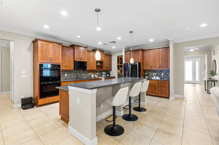 Quartz Countertop with Double Ovens and UPgraded Fridge