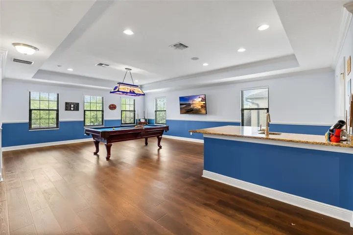 Large Loft upstairs with new engineered hardwood floors and a wetbar. Pool Table is negotiable.
