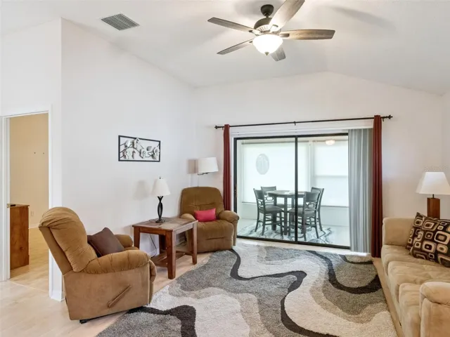 LIVING ROOM LOOKING TOWARD THE NEWLY RENOVATED LANAI