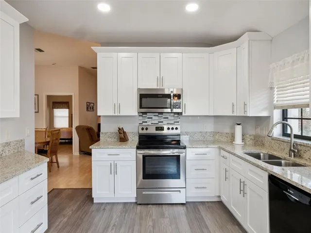 THE KITCHEN HAS BEEN UPDATED WITH STONE COUNTERS, 42