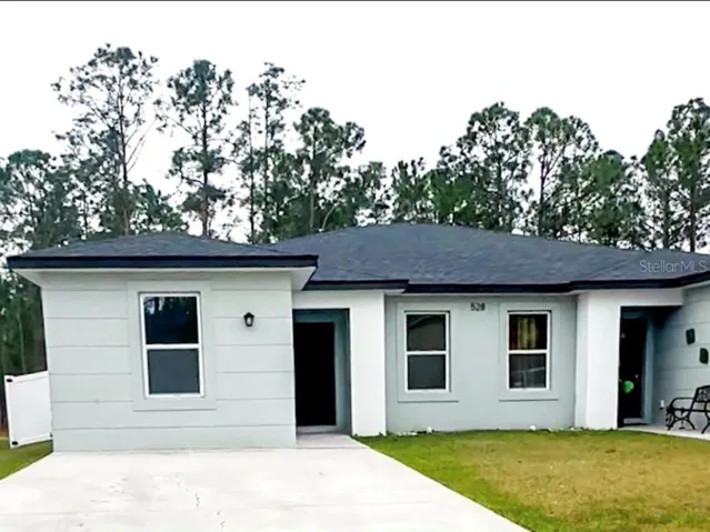 Front exterior view with spacious driveway